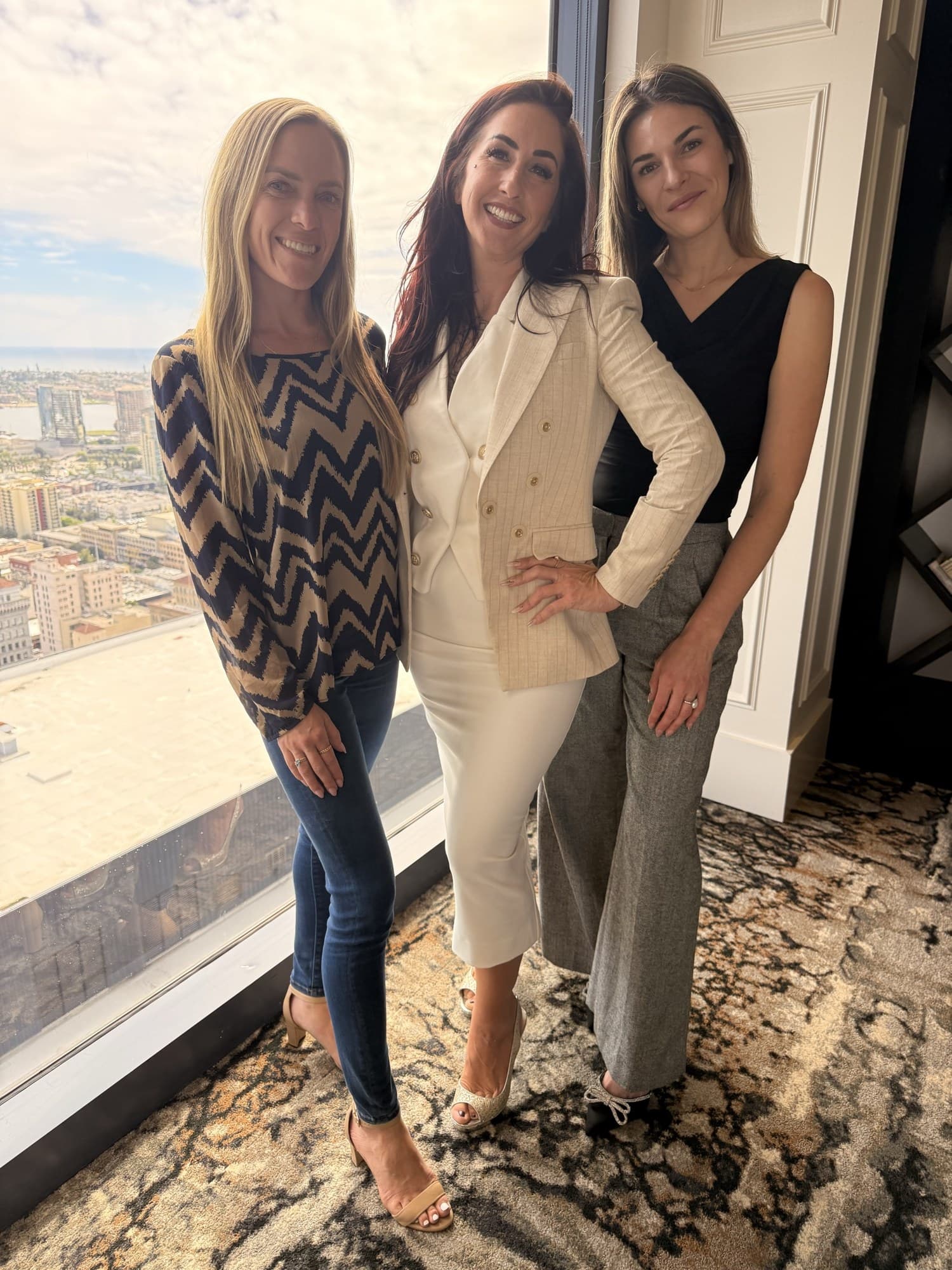 The Buzz Marketing Co team in front of the San Diego skyline